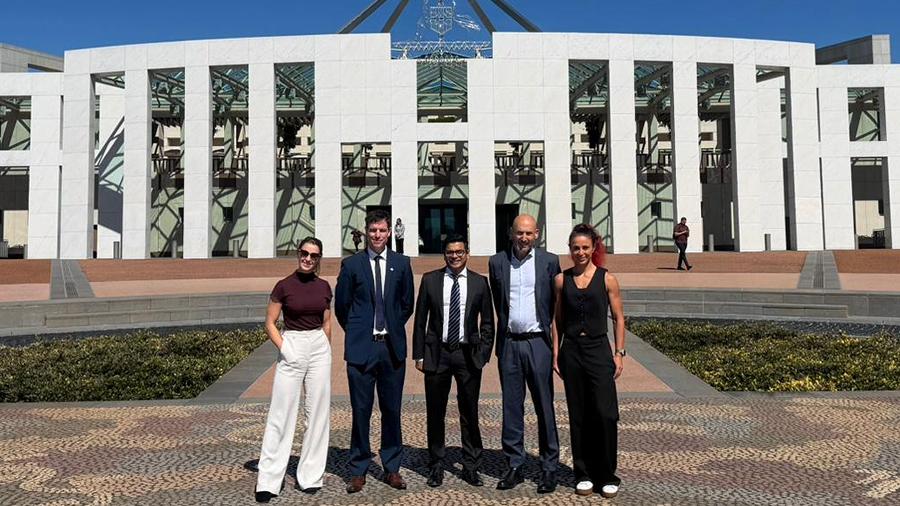 The team outside Parliament House, Canberra Australia.
